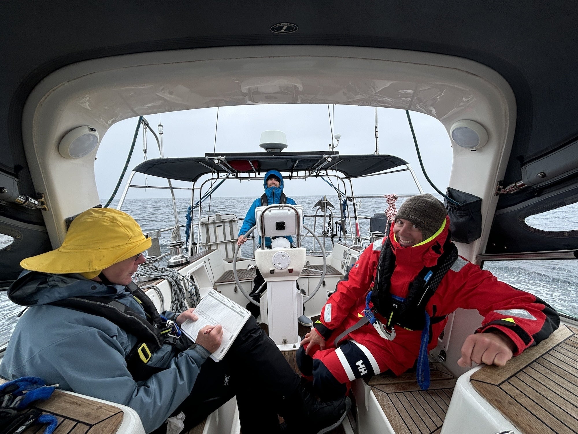 A member of an offshore expedition writing down boat position