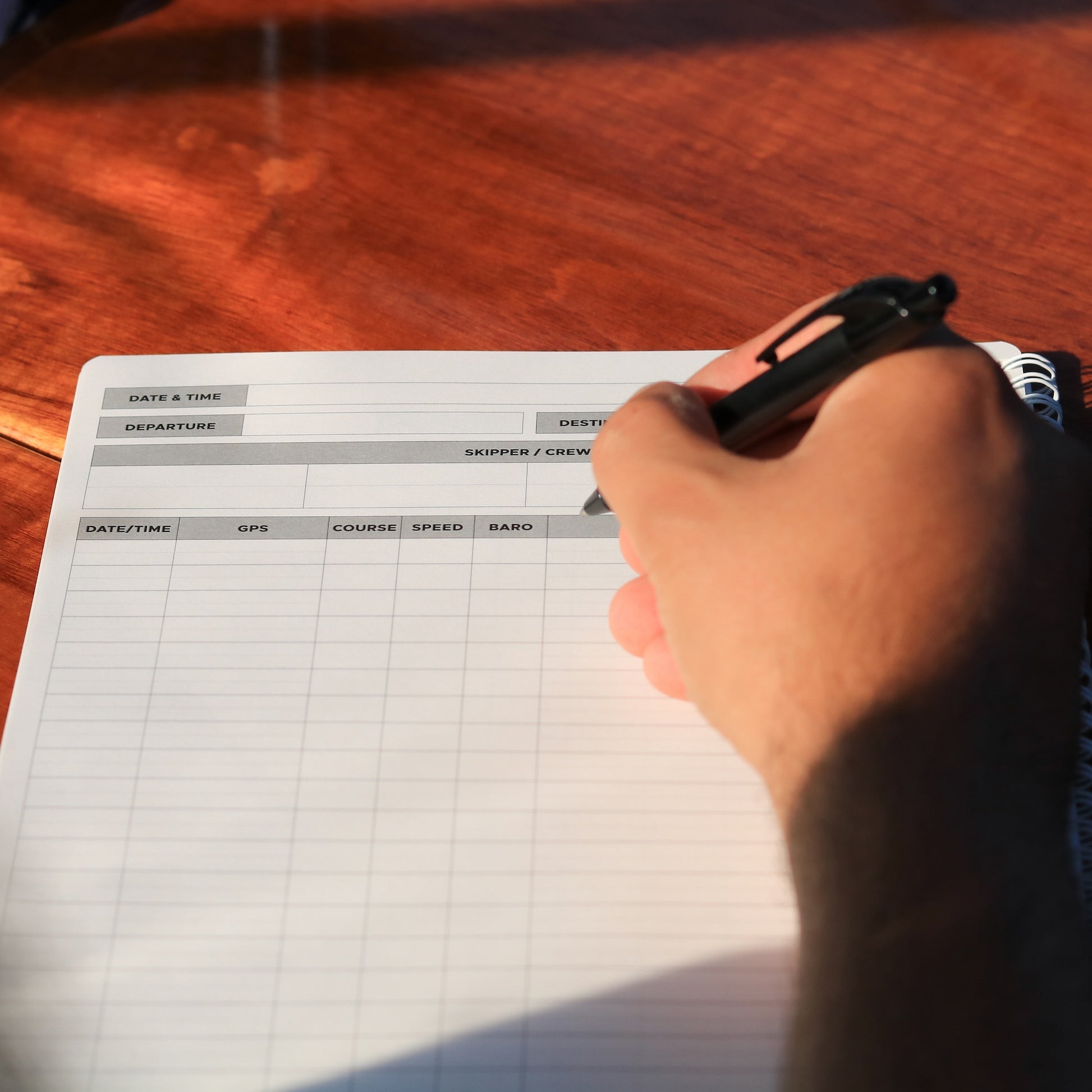 Close-up of updated sailing log pages showing GPS, speed, barometric pressure, and note fields.