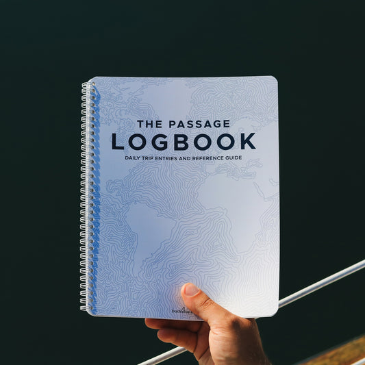 Close-up of the Backstay Passage Logbook cover featuring nautical contour lines.
