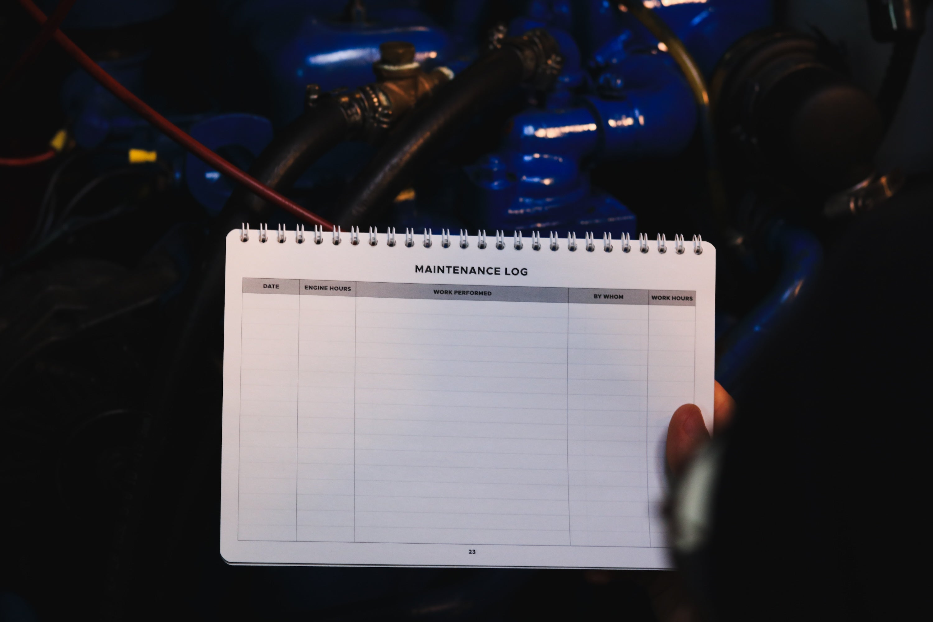 Boat engine maintenance log pages with service entry fields.