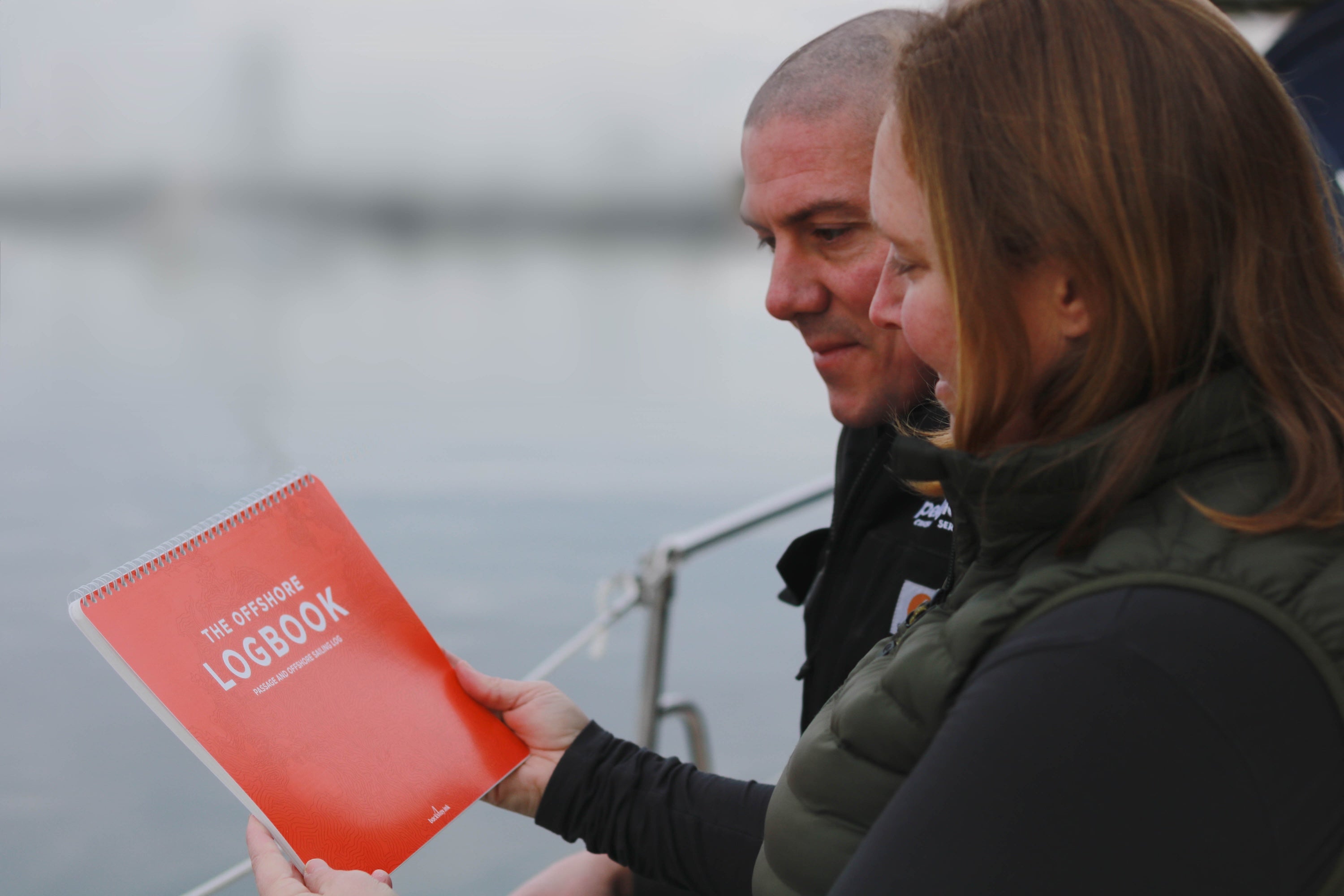 Photo: Pelagic Blue Cruising owners admiring the offshore logbook