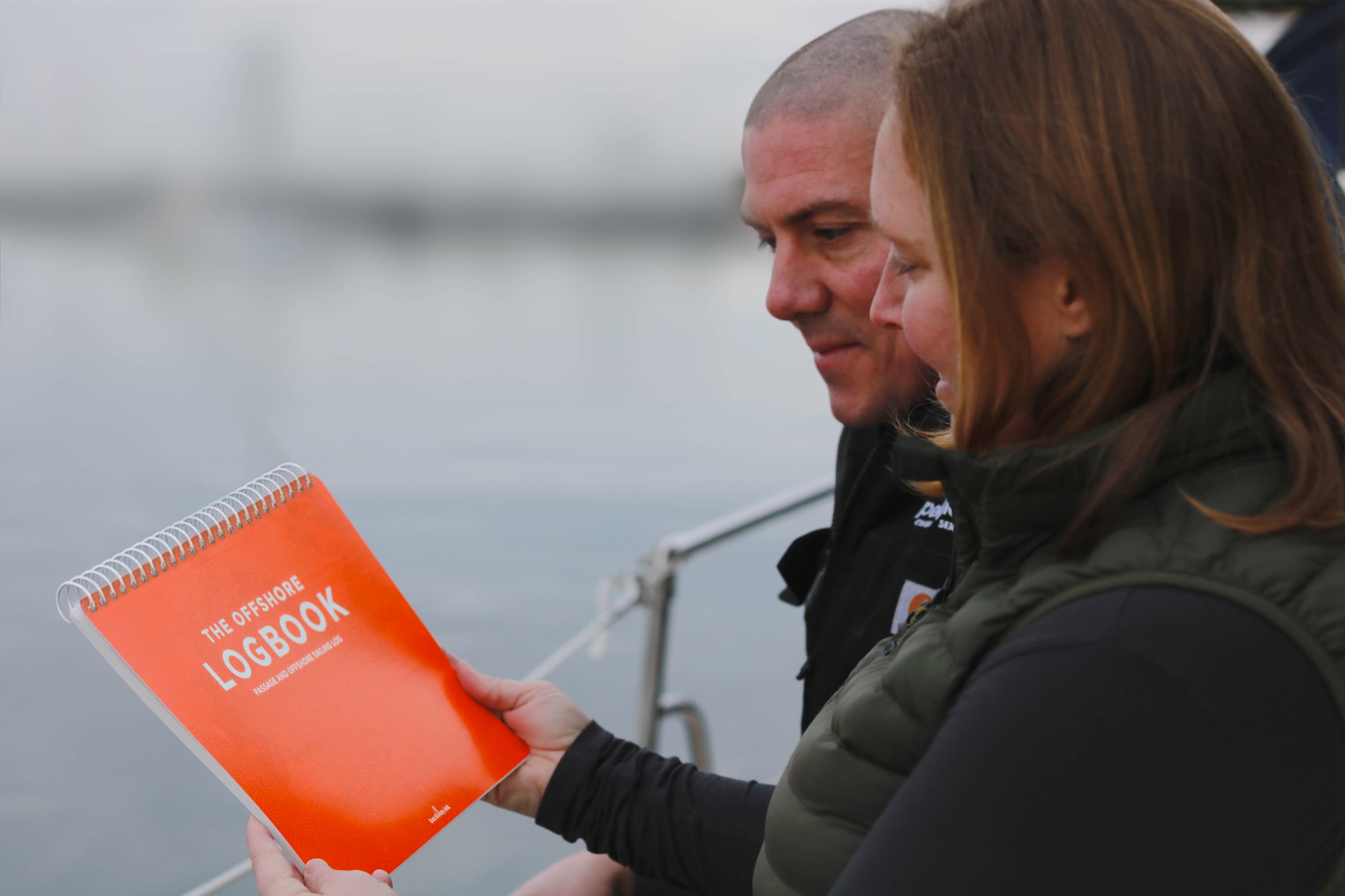 Pelagic Blue Cruising owners admiring the offshore logbook