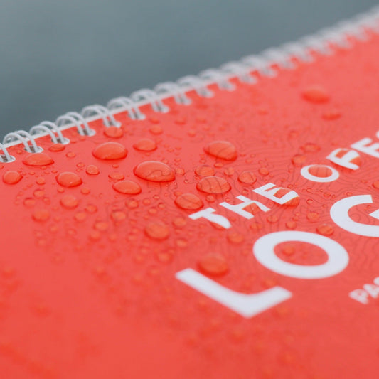 Photo: Water drops on waterproof cover of offshore sailing logbook