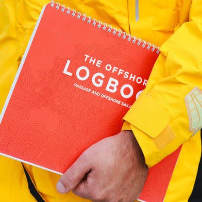 Photo: Sailor holding waterproof offshore sailing logbook